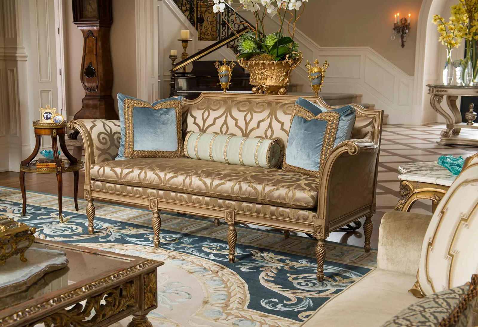 MEG living room with blue and gold sofas
